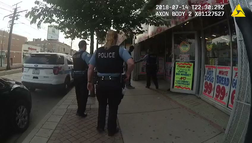 Body camera 1: officers walk past a parked Chicago police SUV toward a corner market