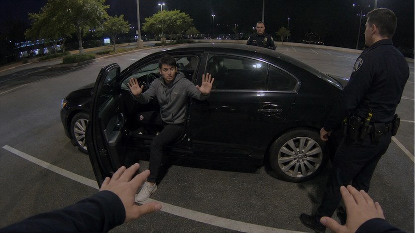 Fictional Officer Jones body-camera view from the driver side of the sedan